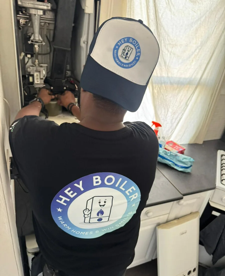 Ahmed on site, servicing a boiler in a London home