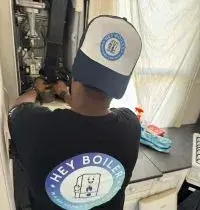 Gas Safe engineer inspecting a boiler